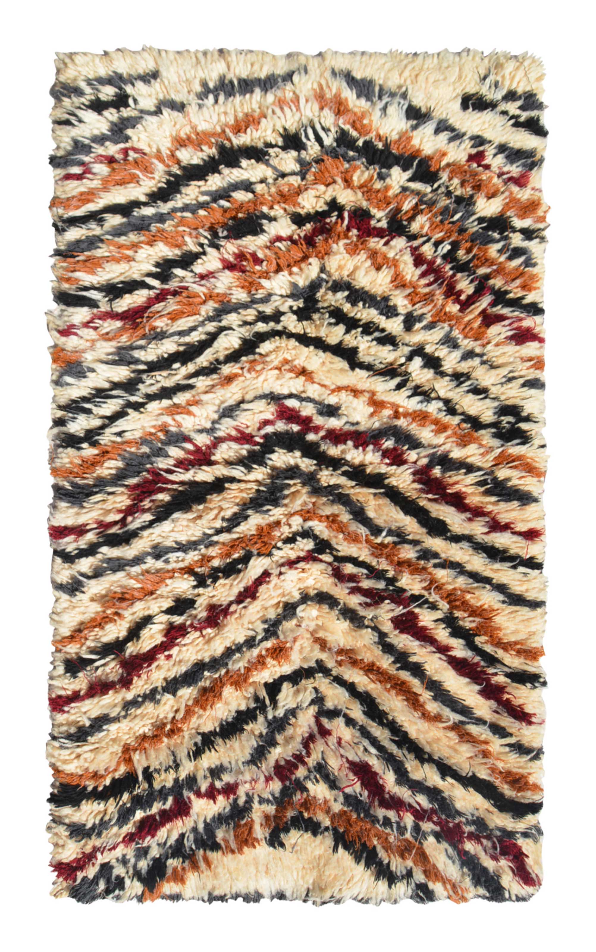 Overhead view of a deeply plush, intensely shaggy handmade 1970s vintage Moroccan wool accent rug named Deep Down (2'8" x 4'8") featuring a thick cream base covered in undulating, wavy chevron lines woven in black, rust orange, and a rare dark ox-blood red, with a 1-inch pile.