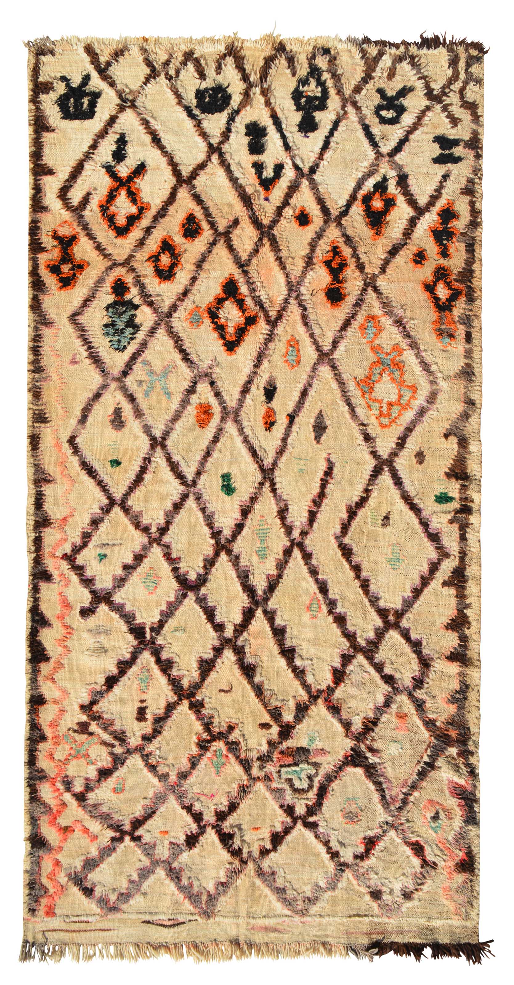 Overhead view of a massive, room-sized handmade 1960s vintage Beni Ourain Moroccan wool area rug named Highest Places (5'10" x 12'6") featuring a natural tan base covered in a brown geometric diamond lattice filled with intricate black and orange tribal symbols, bordered by a wavy peach line on the left edge, with a 3/4-inch pile.