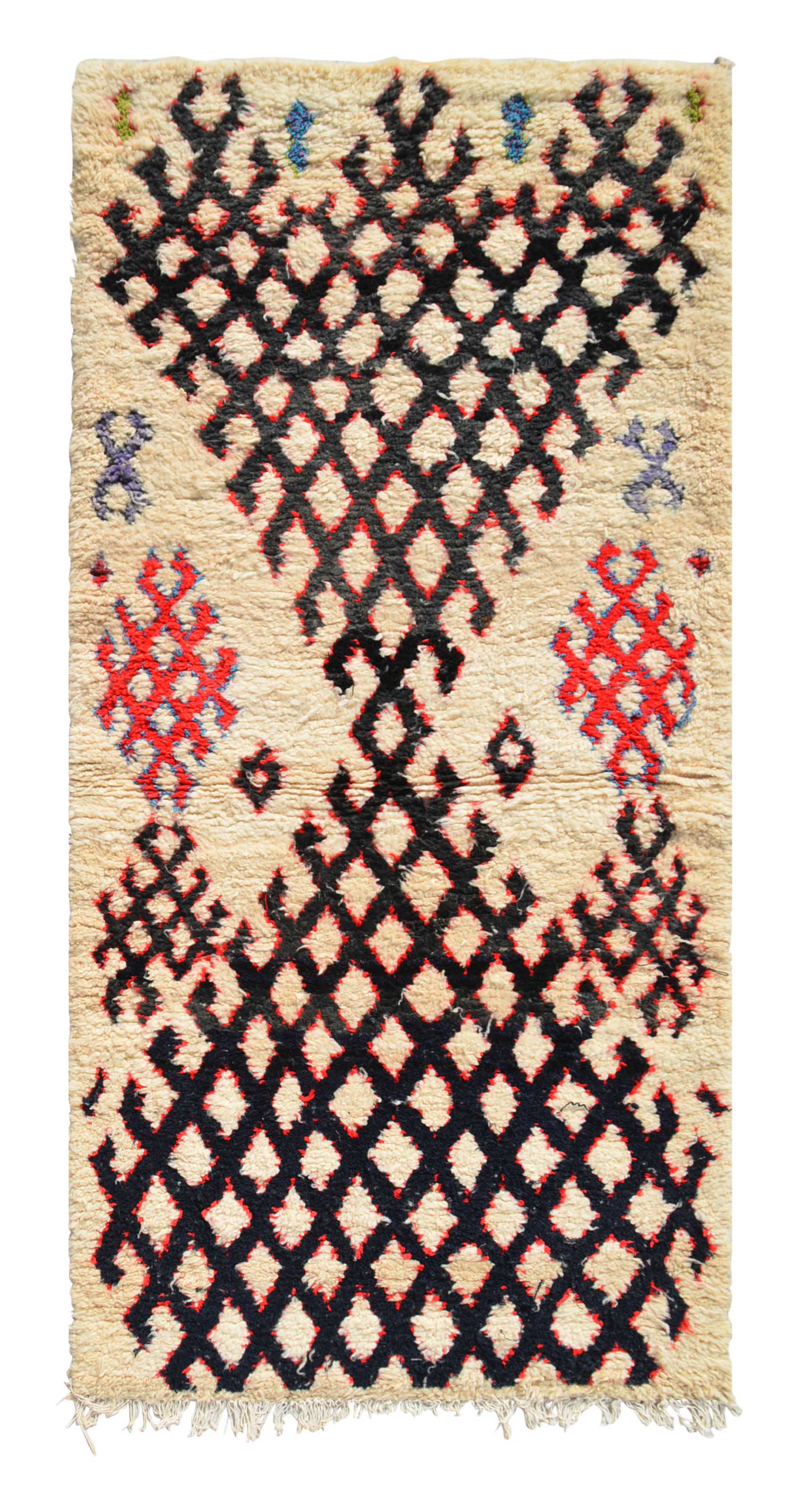 Overhead view of a deeply plush, commanding handmade 1970s vintage Azilal Moroccan wool and cotton runner rug named Front Lines (3'3" x 6'11") featuring a thick cream base dominated by a heavy, hourglass-shaped black geometric diamond lattice with striking red accents and small floating blue and purple motifs, with a 3/4-inch pile.