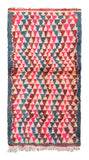 Overhead view of a wonderfully thick, vibrant handmade 1970s vintage Boujaad Moroccan wool accent rug named Julia (3'2" x 5'9") featuring a dense pattern of repeating geometric triangles in bright pink, deep maroon, and slate blue over a cream base, with a 1-inch pile.