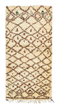 Overhead view of a very soft, deeply plush handmade 1970s vintage Beni Ourain Moroccan wool accent rug named Brown Sugar (2'9" x 5'5") featuring a cream base covered in a wavy, earthy brown geometric diamond lattice with tiny green accents near the top, and a 3/4-inch pile.