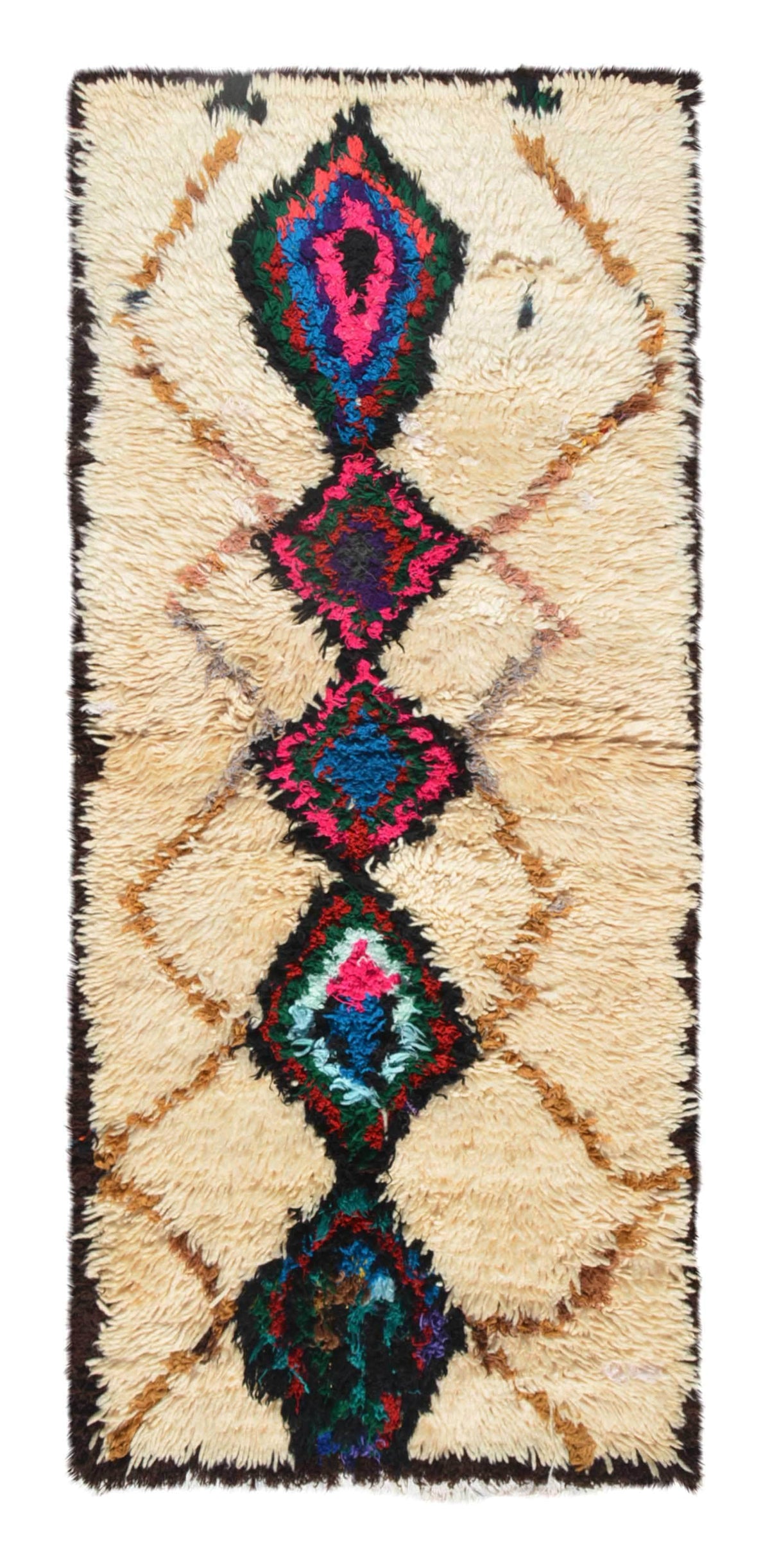 Overhead view of a deeply plush, vibrant handmade 1960s vintage Azilal Moroccan wool and cotton accent rug named In The Crowd (2'4" x 5'4") featuring a cream base with a faint tan lattice background, dominated by a central column of massive black diamond medallions filled with bright pink, blue, green, and red yarn, with a 3/4-inch pile.