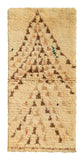 Overhead view of a beautifully soft handmade 1970s vintage Beni Ourain Moroccan wool accent rug named To The North (2'5" x 5') featuring a cream base covered in a large, nested chevron or arrow pattern pointing upwards, woven using a broken, dashed-line technique in earthy brown yarn, with a 3/4-inch pile.