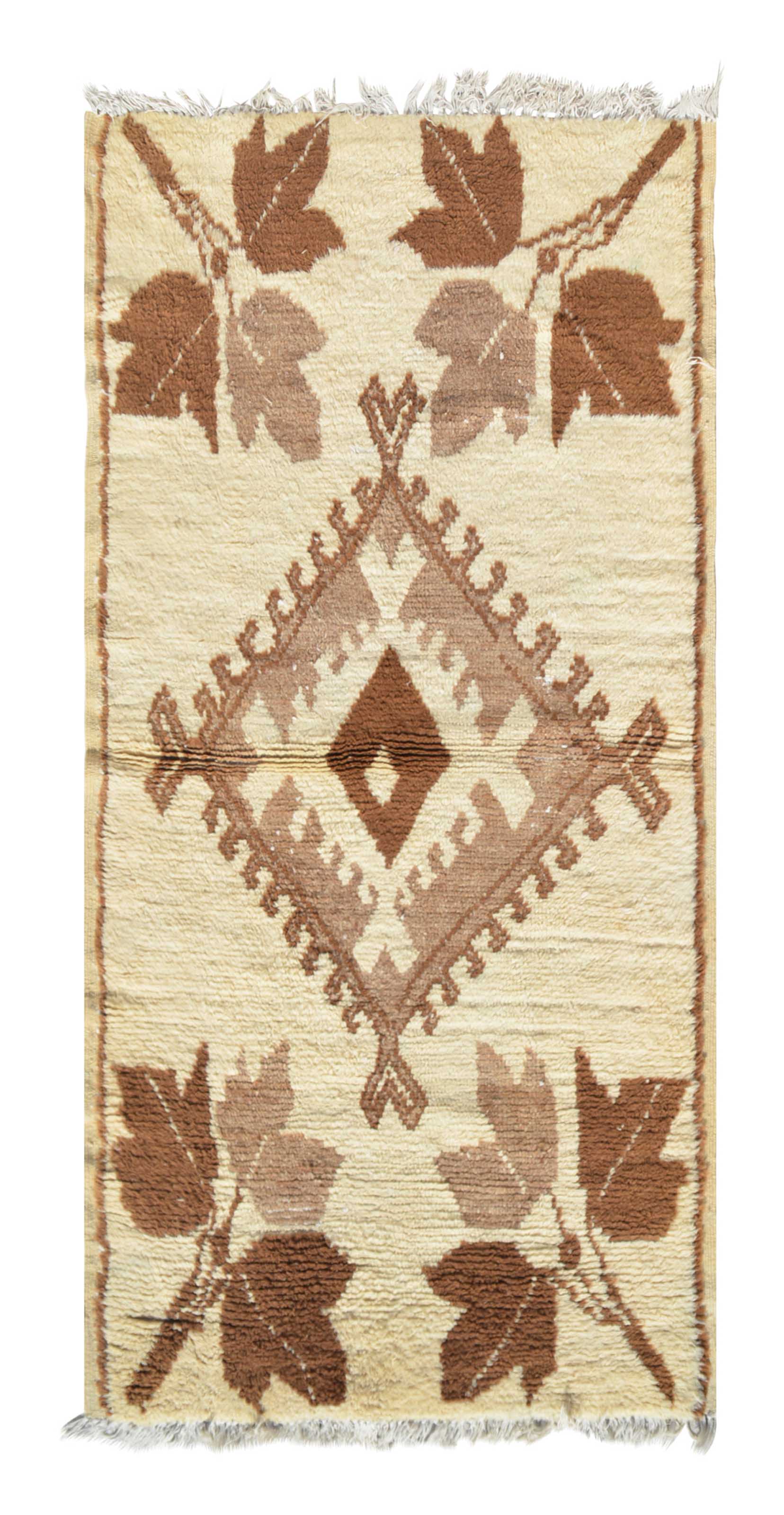Overhead view of a very rare, plush handmade 1970s vintage Beni Ourain Moroccan wool rug named Regal Dreams (3' x 6'2") featuring a cream base with a central stepped diamond and four large corner leaf motifs woven in two-tone earthy brown yarn, with a 3/4-inch pile.