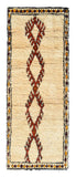 Overhead view of a wonderfully soft, plush handmade 1960s vintage Beni Ourain Moroccan wool and cotton runner rug named Home Grown (3'3" x 8'8") featuring a cream base with a vertical chain of serrated fox brown geometric diamonds, framed by a dark border with yellow and red accents, with a 3/4-inch pile.
