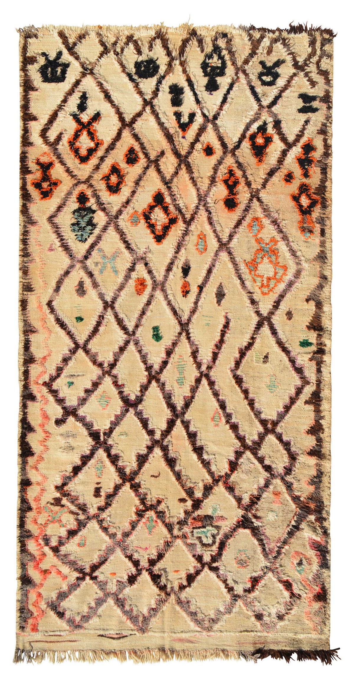Overhead view of a massive, room-sized handmade 1960s vintage Beni Ourain Moroccan wool area rug named Highest Places (5'10" x 12'6") featuring a natural tan base covered in a brown geometric diamond lattice filled with intricate black and orange tribal symbols, bordered by a wavy peach line on the left edge, with a 3/4-inch pile.