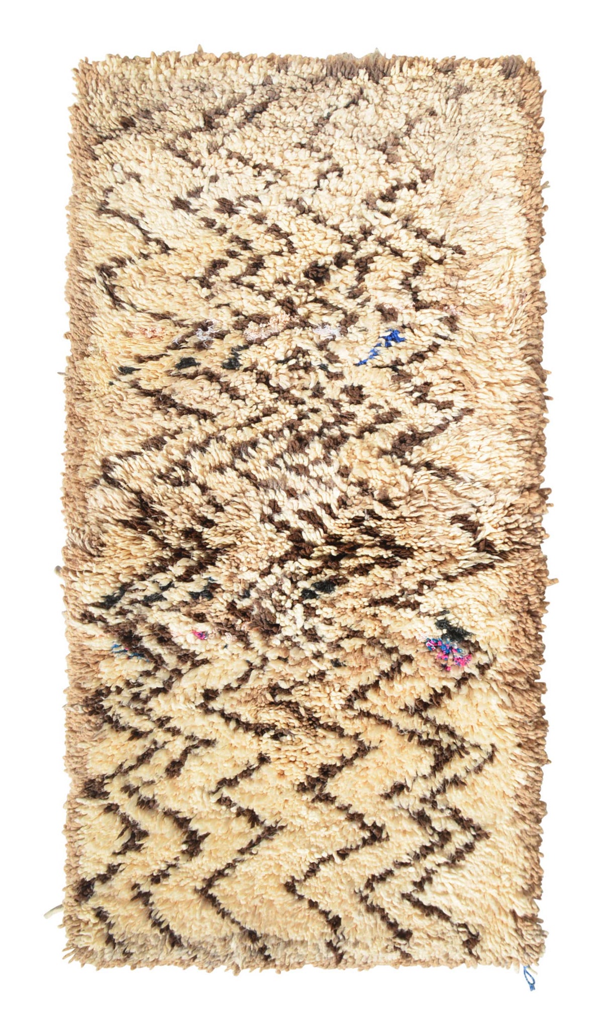Overhead view of a very soft, deeply plush handmade 1970s vintage Beni Ourain Moroccan wool and cotton accent rug named Static (2'10" x 5'8") featuring a cream base covered in energetic, jagged dark brown zigzag lines resembling visual static, with tiny hidden pops of blue and pink, and a 1-inch pile.