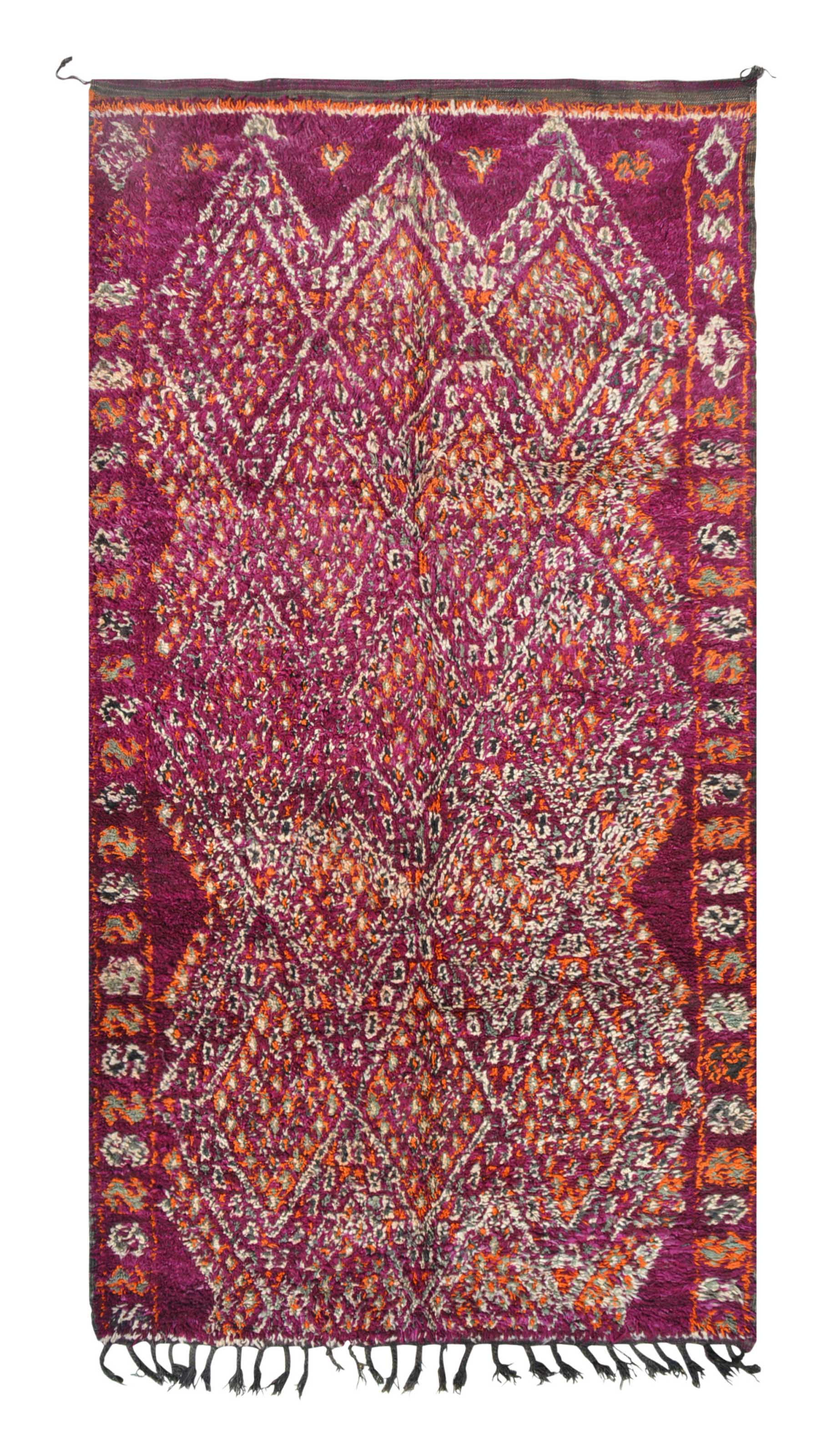 Overhead view of a deeply plush, mesmerizing handmade 1970s vintage Boujaad Moroccan wool area rug named Strawberry Fields (5'9" x 11') featuring a sprawling geometric diamond lattice woven in white, grey, and bright orange over a deep, saturated magenta background, with a 3/4-inch pile.